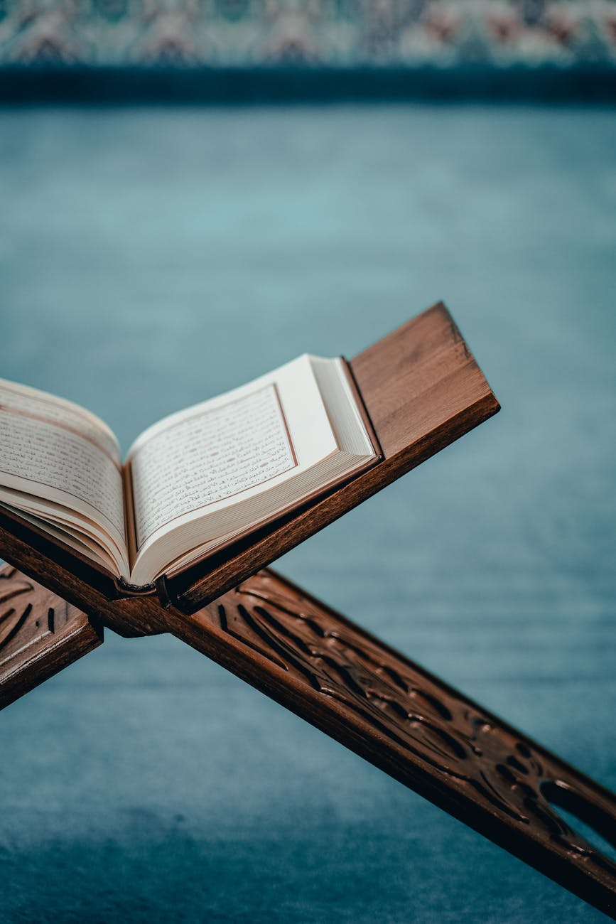 koran on wooden shelf in mosque